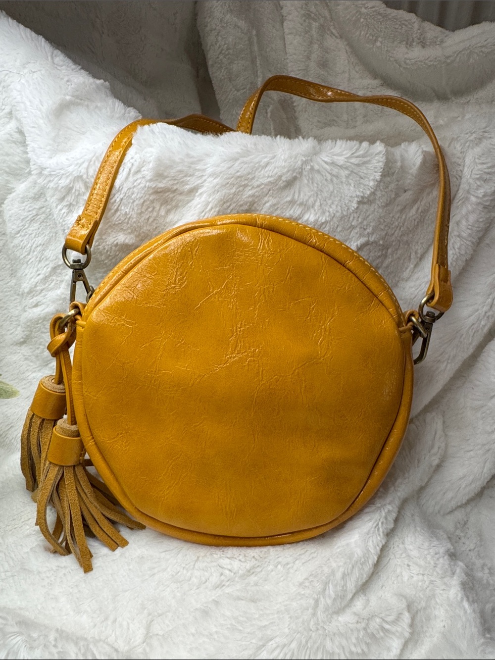 Anthropologie Round Tassel Crossbody Bag in Mustard